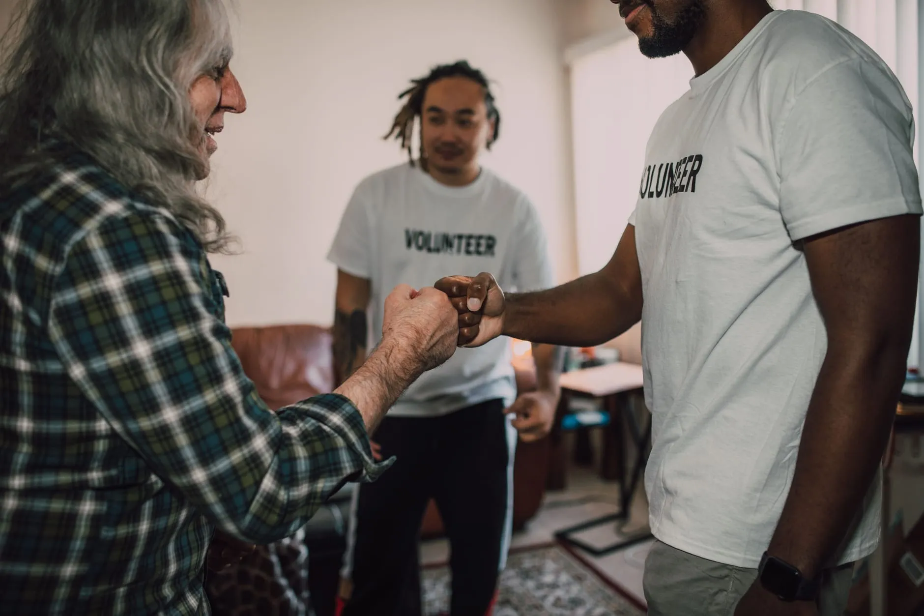 Community volunteers greeting a member of the public