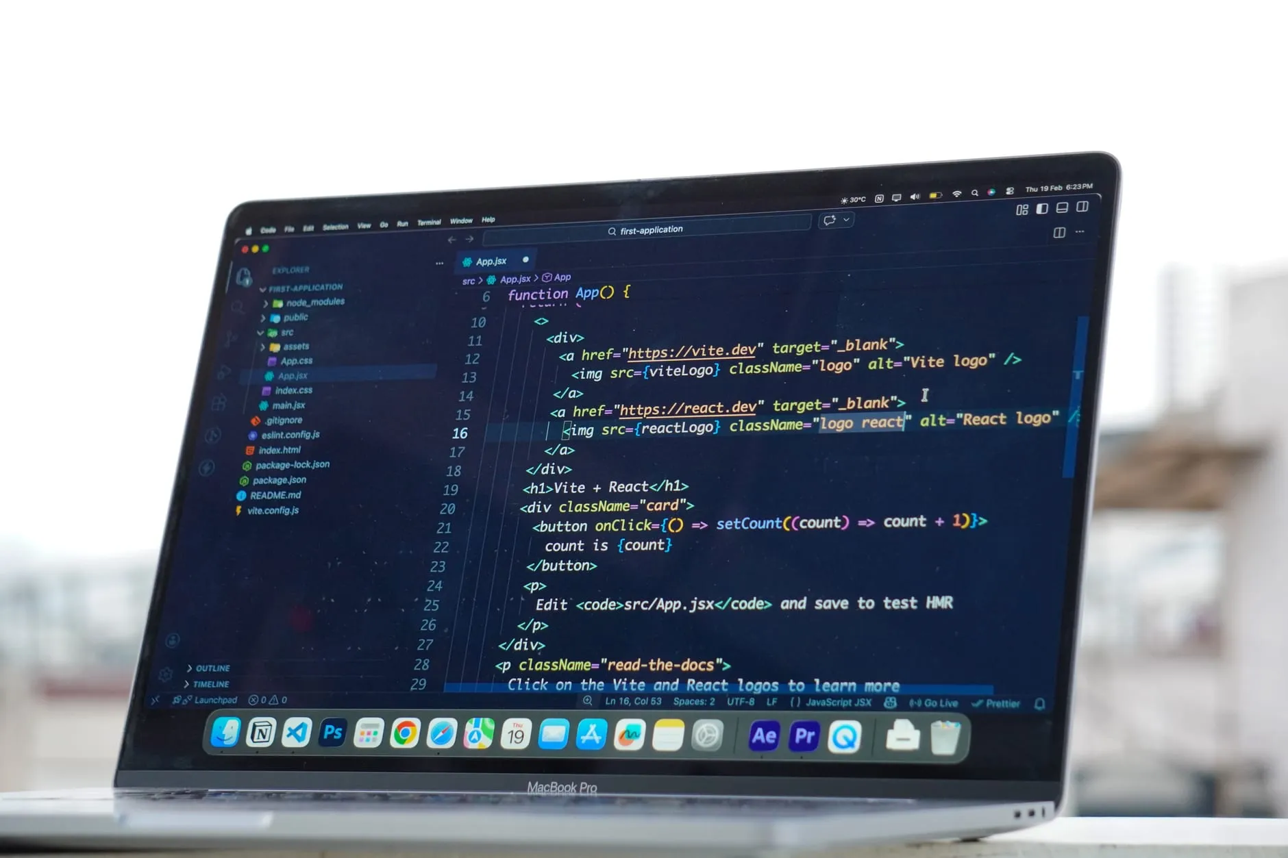 A laptop showing website code, representing monthly website care and maintenance plans