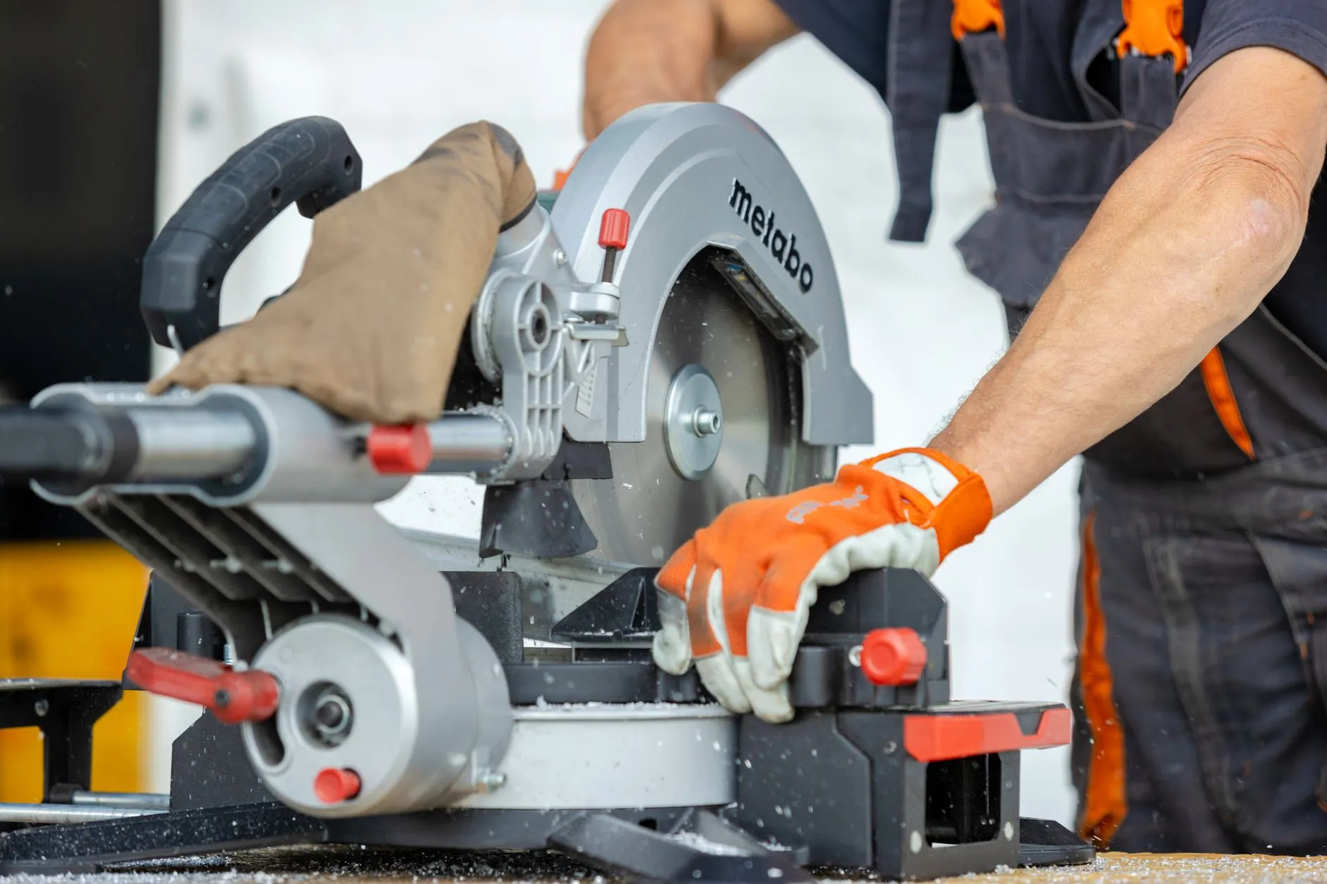 A tradesperson using a power tool on a job site